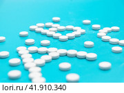 White tablets near the pharmacy jar in the shape of the letters ABC. Стоковое фото, фотограф Ярославский Максим / Фотобанк Лори