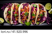 Row of Mexican street Tacos on slate with carne asada and al pastor in corn tortilla. Стоковое AI-изображение, AI-художник Ирина Ручушкина / Фотобанк Лори