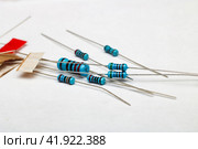Heap of blue resistors close up on white background. Стоковое фото, фотограф Аксенова Вера / Фотобанк Лори