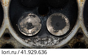 Valve in a deposit on the removed cover of the engine valve box. Стоковое фото, фотограф Леонид Еремейчук / Фотобанк Лори