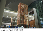 Istanbul, Turkey 12.31.23: international airport Istanbul Havalimani IST. New Year and Christmas decorations, garlands, small architectural forms. Multi-colored light bulbs create festive atmosphere. Редакционное фото, фотограф Юлия Петровская / Фотобанк Лори