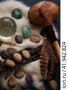 handmade stone runes on white fur. Стоковое фото, фотограф Boris Vasilenko / Фотобанк Лори