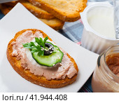 Canape with pate and young cheese and tomatoe at bread, served on desk. Стоковое фото, фотограф Яков Филимонов / Фотобанк Лори