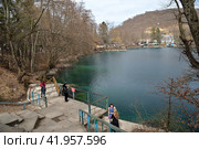 Chereksky district, Kabardino-Balkarian Republic, Russia, March 12, 2023: Lower Blue Lake (Tserik-Kel, Cherek-Kel) one of five karst reservoirs, near Babugent village, on Cherek-Balkarsky river bank. Редакционное фото, фотограф Алексей Антипов / Фотобанк Лори
