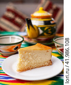 dessert cheesecake in oriental style with a teapot and a cup for tea. Стоковое фото, фотограф Abakumova Ekaterina / Фотобанк Лори