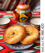 traditional Uzbek bread. Lepeshka - oriental style bread. Eastern cuisine. Стоковое фото, фотограф Abakumova Ekaterina / Фотобанк Лори