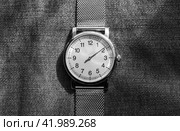 Single hand watch in stainless steel case. Close-up. Стоковое фото, фотограф EugeneSergeev / Фотобанк Лори