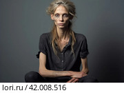 An anorexic woman depressed and tired. Стоковое AI-изображение, AI-художник Irina Kuchugurina/Gaudy / Фотобанк Лори