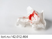 Fresh red blood stained on tissue paper on white table. Стоковое фото, фотограф Евдокимов Максим / Фотобанк Лори