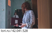 A young student peeks at the teacher's journal. Стоковое видео, видеограф Mikhail Davidovich / Фотобанк Лори