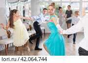 Teenage girl dancing jitterbug with partner during student dance event. Стоковое фото, фотограф Яков Филимонов / Фотобанк Лори