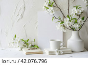 white paper template and pictures of white apsara flowers on a white table. Стоковое AI-изображение, AI-художник Юлия Гапеенко / Фотобанк Лори