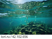 Problematic plastic bottles and microplastics floating in the open ocean. Marine plastic pollution concept. Стоковое AI-изображение, AI-художник Ирина Михайличенко / Фотобанк Лори