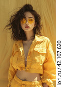lu fei kang wearing a yellow jacket & shorts. Стоковое AI-изображение, AI-художник Юлия Гапеенко / Фотобанк Лори