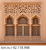 Ornament lattice window in india. Стоковое AI-изображение, AI-художник Михаил Коханчиков / Фотобанк Лори