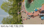 Cherepovets, Russia - May 27, 2023, Sunny Playdates and Family Moments at the Park. FPV Aerial Drone Shot. Vertical. Редакционное видео, видеограф Даниил Хабаров / Фотобанк Лори