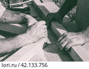 The hands of the workers carpenters, joiners. black and white photo. Стоковое фото, фотограф Андрей С / Фотобанк Лори