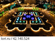Aerial view to largest light and music fountain in Russia. 2214 colours jets burst into sky with musical accompaniment. Night show fire on the water in Nizami Ganjavi Park Derbent, Dagestan, Europe. Стоковое фото, фотограф Алексей Ширманов / Фотобанк Лори