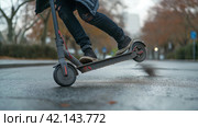 Man falling off an electric scooter. Стоковое AI-изображение, AI-художник Кирилл Черезов / Фотобанк Лори