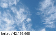 White Cirrus clouds in a blue sky. Close up sky with clouds. Стоковое видео, видеограф Глущенко Елена / Фотобанк Лори