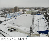 Вид с высоты на стадион "Родина" в городе Кирове зимой перед матчем (аэросъемка 2019 года) Редакционное фото, фотограф Владислав Самошкин / Фотобанк Лори