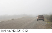 Car on the side of a rural road. Poor visibility in fog. Foggy landscape. Стоковое фото, фотограф Андрей Степанов / Фотобанк Лори