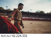 Bull fighting torero. Generate Ai. Стоковое AI-изображение, AI-художник Иван Рябоконь / Фотобанк Лори