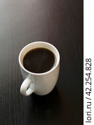 White cup of coffee on wooden table. Стоковое фото, фотограф Аксенова Вера / Фотобанк Лори