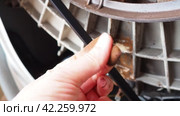 Damage to bearing unit in the washing machine. Demonstration by hand of rusty stains on the tank and bowl of the washing machine with the back cover removed. Service repair of household appliances. Стоковое видео, видеограф Юлия Петровская / Фотобанк Лори