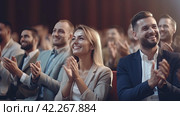 Business people applaud, celebrating a successful presentation. Teamwork and achievements fill the hall with positive energy. Стоковое AI-изображение, AI-художник Ярославский Максим / Фотобанк Лори