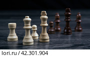 Various chess pieces on a wooden background still life. Стоковое фото, фотограф Александр Калугин / Фотобанк Лори