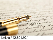 Fountain pen on paper with ink text on the paper. Стоковое фото, фотограф Александр Калугин / Фотобанк Лори