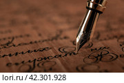 Fountain pen on paper with ink text on the wooden desk. Стоковое фото, фотограф Александр Калугин / Фотобанк Лори