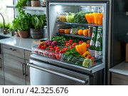 Fully stocked fridge with fresh fruit, vegetables and assorted beverages viewed through the open door in a healthy lifestyle concept. Стоковое AI-изображение, AI-художник Ирина Михайличенко / Фотобанк Лори