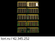 Computer memory module DDR SDRAM in isolated black background. Desktop workstation server RAM memory chipsets. system, main memory, random access memory, computer detail. Стоковое фото, фотограф Константин Григорьев / Фотобанк Лори