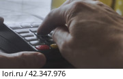 A bank plastic card is inserted into the terminal for payment and a PIN code is entered. Стоковое видео, видеограф Ярославский Максим / Фотобанк Лори