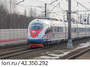 Скоростной электропоезд ЭВС1-20 "Сапсан" на станции Славянка мартовским днем. Октябрьская железная дорога (2024 год). Редакционное фото, фотограф Виктор Карасев / Фотобанк Лори
