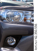 Headlight of an expensive off-road car close-up. Стоковое фото, фотограф Евгений Ткачёв / Фотобанк Лори
