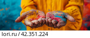 Background for the Holi holiday, voluminous and airy colored powder on the palms of the hands of an elderly old woman and empty space for design. Banner. Стоковое AI-изображение, AI-художник Мария Фадеева / Фотобанк Лори