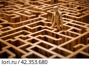 Confused Lost man in wooden tangled maze. Generate ai. Стоковое AI-изображение, AI-художник Иван Рябоконь / Фотобанк Лори