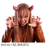 Girl frightens under the guise of the devil. Isolated on white background. Стоковое фото, фотограф Дмитрий Кобзев / Фотобанк Лори