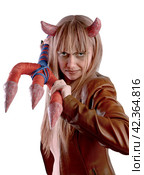 Girl in devil costume with a trident on Halloween on a white background. Стоковое фото, фотограф Дмитрий Кобзев / Фотобанк Лори