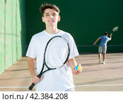 Portrait of caucasian man frontenis player in outdoor court. Стоковое фото, фотограф Яков Филимонов / Фотобанк Лори