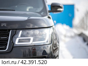 KRASNOYARSK, RUSSIA - March 15, 2024: Black Land Rover Range Rover. Редакционное фото, фотограф Плотников Дмитрий / Фотобанк Лори