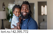 A happy father embraces his little son in a warm embrace at home. Generated by AI. Стоковое AI-изображение, AI-художник Ярославский Максим / Фотобанк Лори