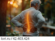 Lumbar intervertebral spine hernia, old man with back pain outdoors, spinal disc disease, health problems concept, AI Generated. Стоковое AI-изображение, AI-художник Станислав Тарко / Фотобанк Лори
