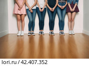 Девушки стоят в ряд у стены, стесняются волнуются, ноги и руки в центре внимания, деревянный пол. Стоковое AI-изображение, AI-художник Vladimir Vikhrov / Фотобанк Лори