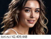 Perfect elegant woman with wet hair posing at shadow, laughing looking at camera. Portrait of sexy stylish cover lady model poses in dark studio. Fashionable style image concept. Copy ad text space. Стоковое AI-изображение, AI-художник Aleksandr Golubev / Фотобанк Лори