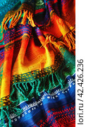 Bright colorful poncho background for Mexican holiday celebration. Vertical banner 3:5. Стоковое AI-изображение, AI-художник Катерина Ковалева / Фотобанк Лори