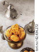 Muslim holiday sweets. Moroccan chebakia, chak-chak and handmade nath. Homemade Muslim sweet baked goods. Стоковое фото, фотограф Оксана Медведева / Фотобанк Лори